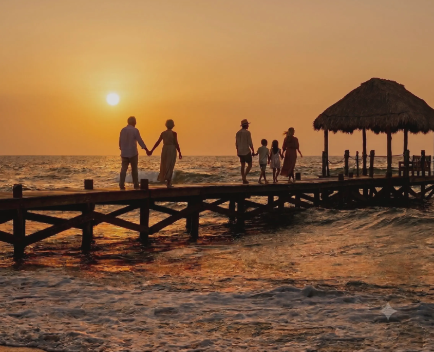 Multi-generational family walking together on a waterfront pier during golden hour, representing Florida estate planning and protecting a family’s future.